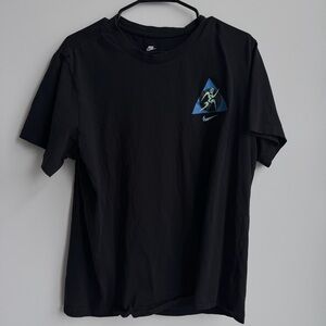 Nike Men's Black Tee with Blue Triangle Graphic